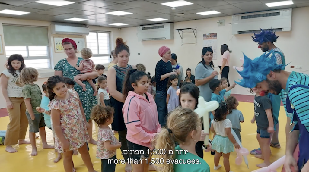 Still from video showing group of children in a school setting
