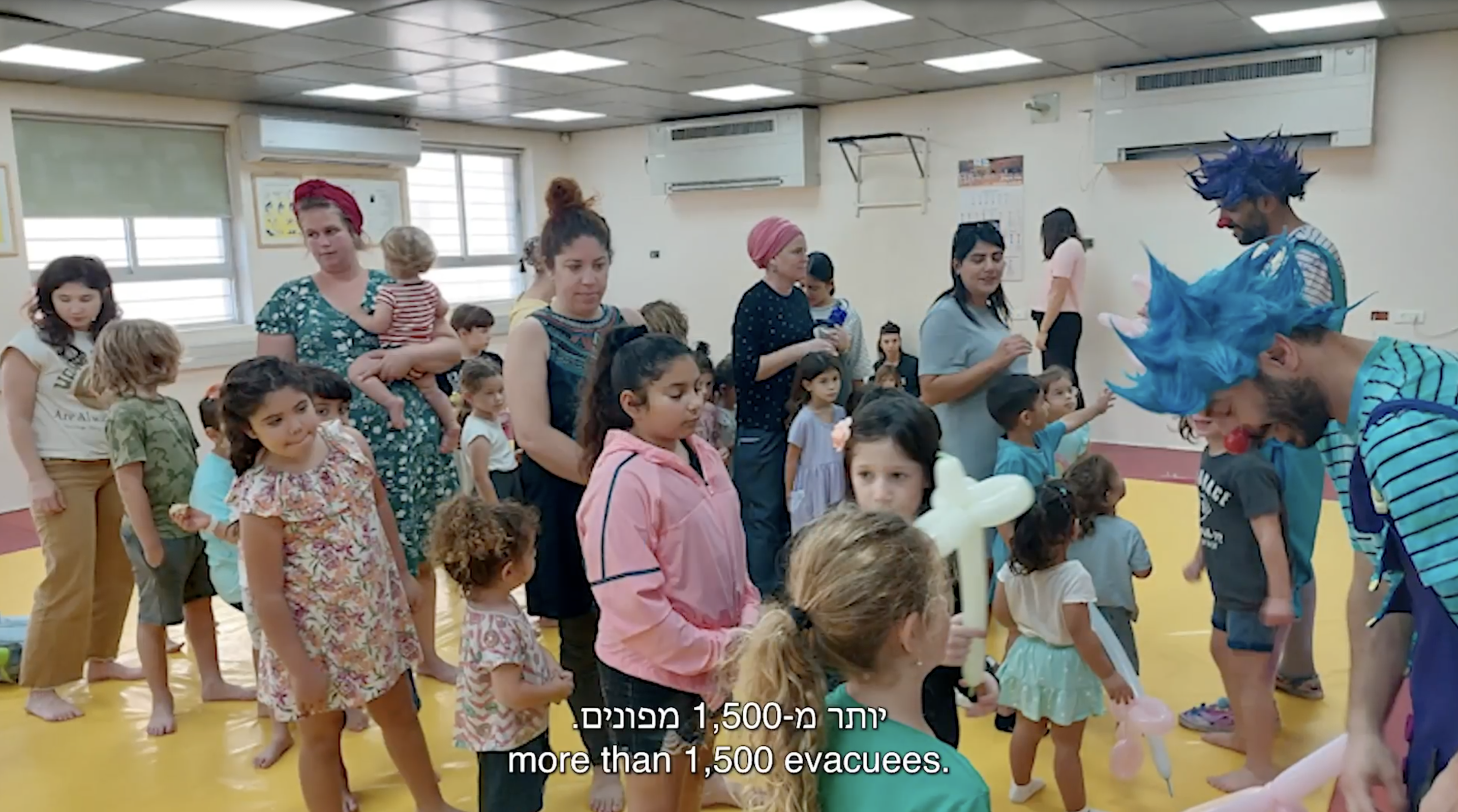 Still from video showing group of children in a school setting